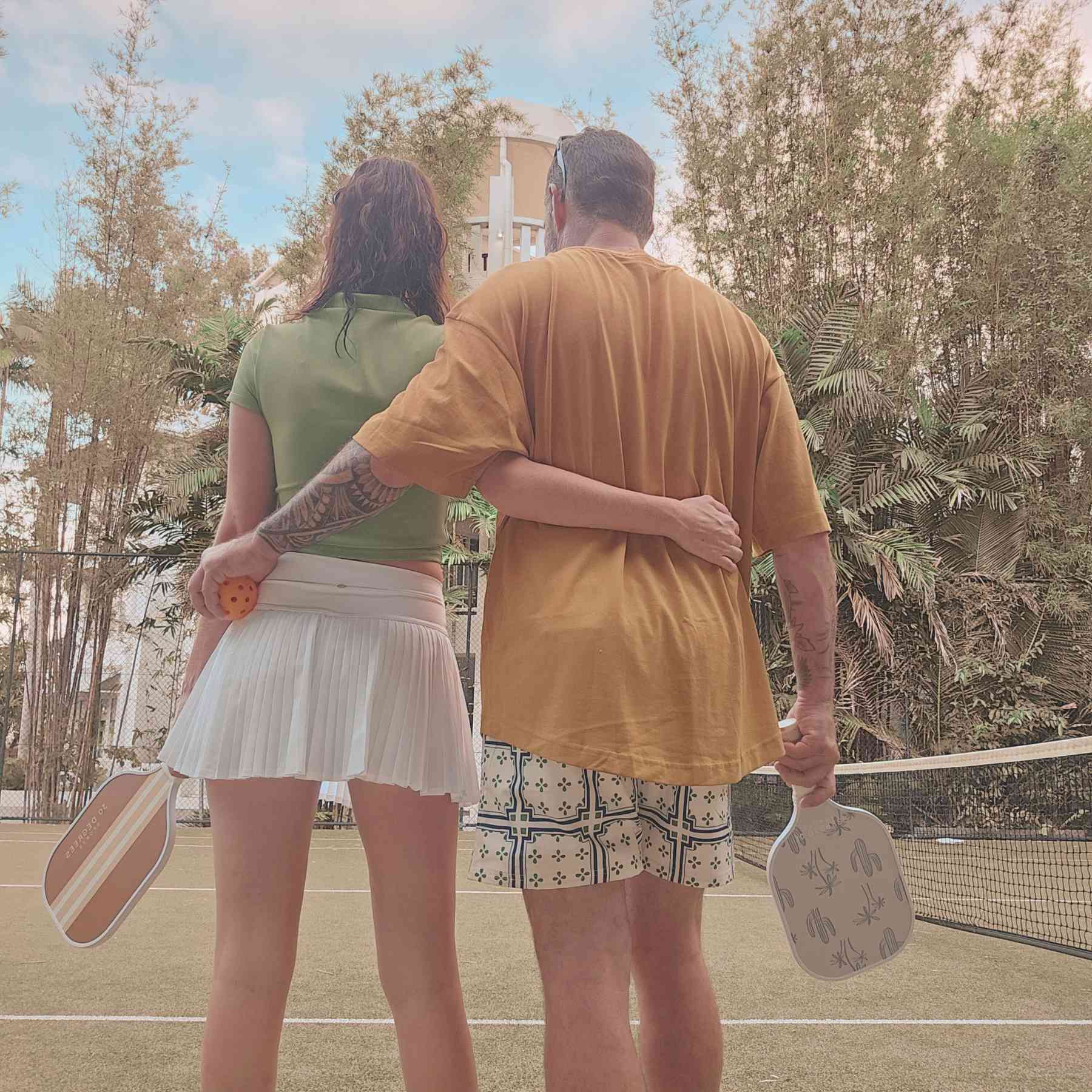 two pickleball players hugging at the end of a game
